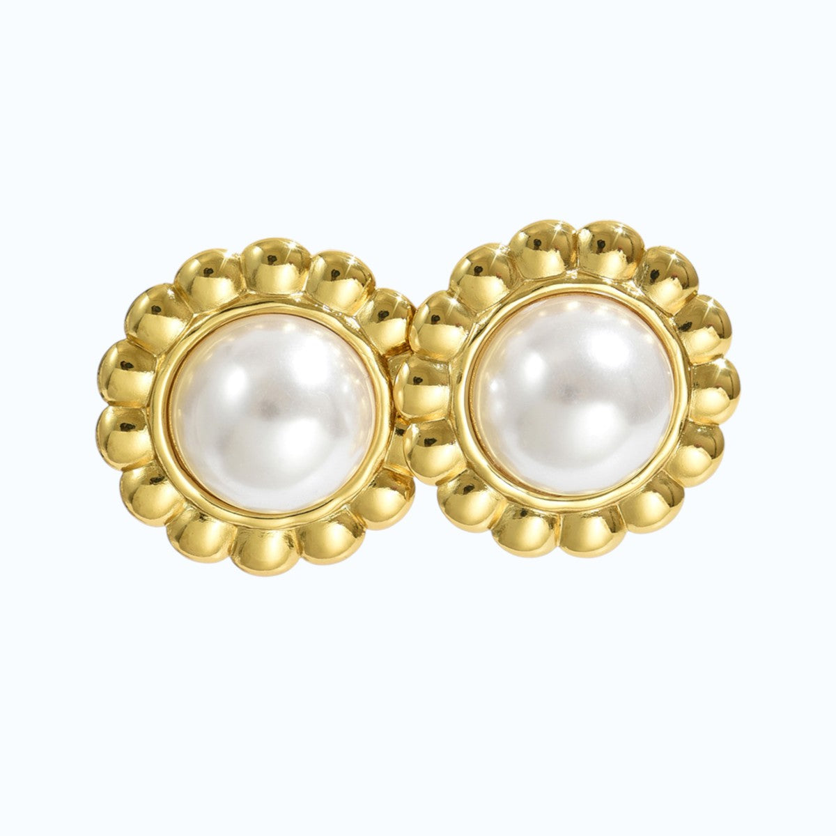 Aretes perla.
