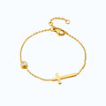 Pulsera cruz.